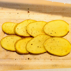 Sliced potatoes seasoned with pepper