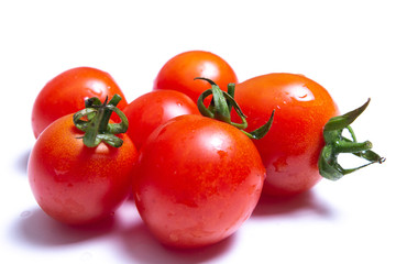 Red tomatoes isolated on white background.