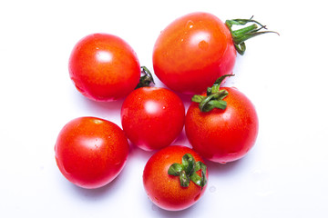 Red tomatoes isolated on white background.