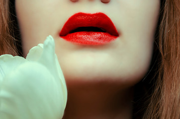 women with red lips and white flower