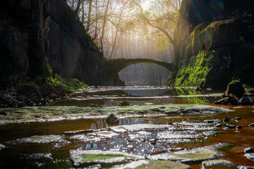 Paradise stone bridge in the forest with rocks