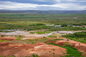 Visitors at Haukadalur geothermal valley waiting for Great Geysir or Strokkur geysir Golden Circle Tourist Route Iceland Scandinavia