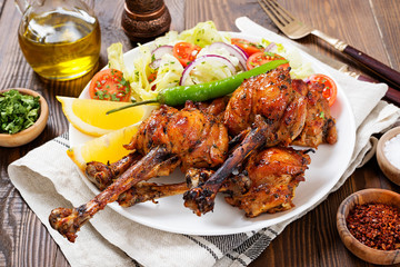 Grilled chicken legs with spices. Turkish Pirzola Kebab .