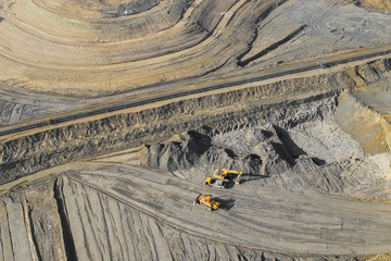 Aerial view of excavator and construction equipment. Machinery and mine equipment from above. Top...