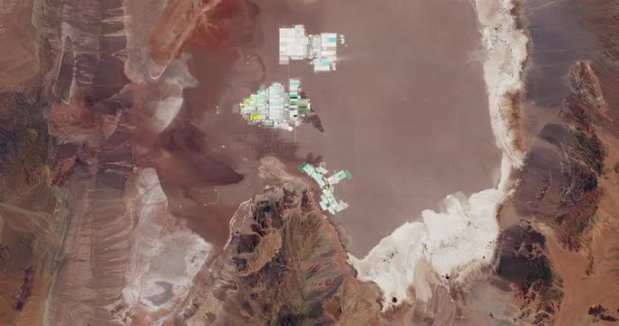Very high-altitude overflight aerial of lithium evaporation ponds in Chiles' Salar de Atacama. Reversible, seamless loop. Elements of this image furnished by NASA. 