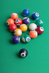 Billiard balls on a green table close-up