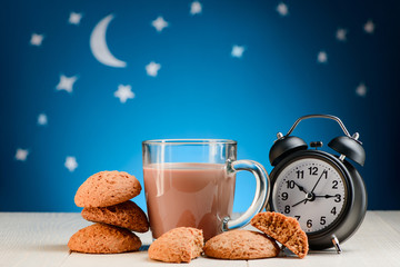 Yummy cookies, cocoa and clock