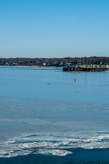 Winter afternoon on icy harbor