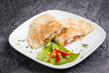 tasty fresh quesadilla with chicken meat and vegetables
