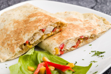 tasty fresh quesadilla with chicken meat and vegetables
