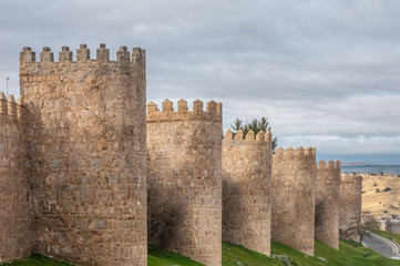 Fototapeta na wymiar The magnificent medieval walls of Avila, Castile-Leon, Spain. A UNESCO World Heritage Site completed between the 11th and 14th centuries