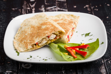 tasty fresh quesadilla with chicken meat and vegetables