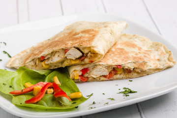 tasty fresh quesadilla with chicken meat and vegetables