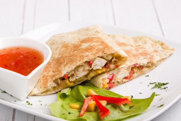 tasty fresh quesadilla with chicken meat and vegetables