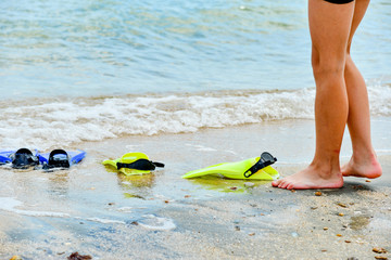A man wearing flippers for swimming under water.