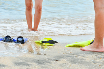 A man wearing flippers for swimming under water.