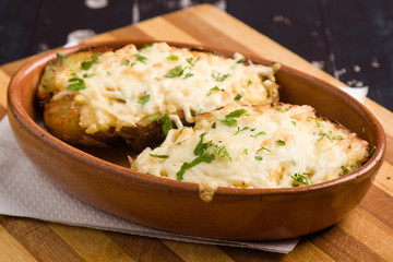 fresh healthy baked delicious baked potato on white plate