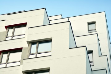 Modern apartment buildings on a sunny day with a blue sky. Facade of a modern apartment building