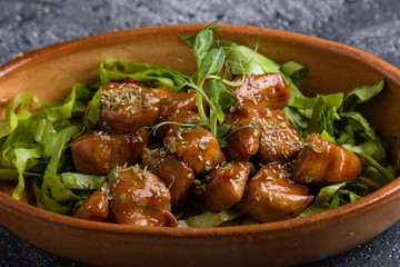 small tasty fresh chicken bites in a rustic bowl