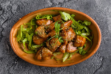 small tasty fresh chicken bites in a rustic bowl