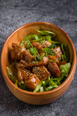 small tasty fresh chicken bites in a rustic bowl