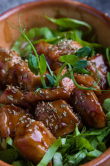 small tasty fresh chicken bites in a rustic bowl
