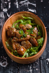 small tasty fresh chicken bites in a rustic bowl