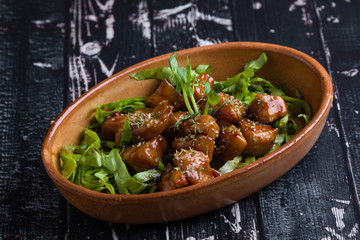 small tasty fresh chicken bites in a rustic bowl