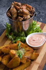 fried chicken wings with potato and dipping sauce