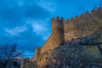 Fototapeta premium The magnificent medieval walls of Avila, Castile-Leon, Spain. A UNESCO World Heritage Site completed between the 11th and 14th centuries