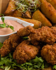 deep fried crispy chicken with fries and dipping sauce