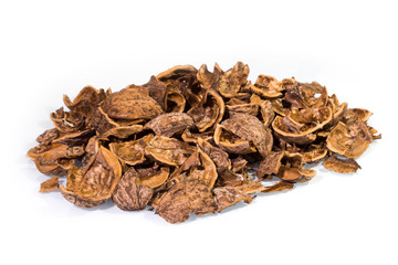 Pile of cracked Walnut shells isolated on white background