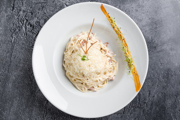 italian spahetti carbonara pasta in white plate