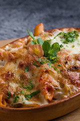 tasty delicious penne rigate pasta in rustic bowl