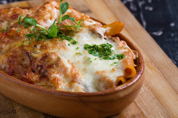 tasty delicious penne rigate pasta in rustic bowl