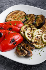 fresh vegetarian healthy grilled vegetables on white plate