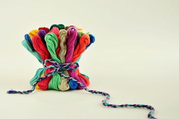 Colored thread embroidery floss in the shape of a bouquet close-up