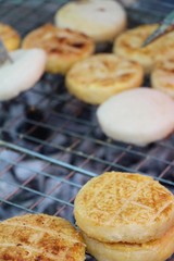 Grilled sticky rice with egg plating on stove