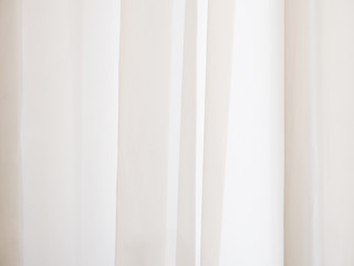 Beige abstract texture with vertical lines.