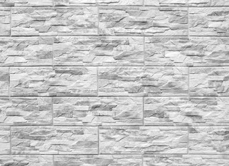 Abstract black and white background. Artificial stone wall. Stone texture, stone uneven surface.