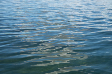 Fototapeta premium Background from the blue expanse of lake with small waves.