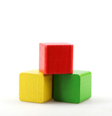 Studio Shot Of Colorful Toy Blocks Against White Background