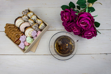 cake background. Close up of chocolate cake background. Fresh assorted cookies in the box. The...