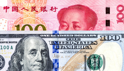 Chinese yuan banknote and american dollar