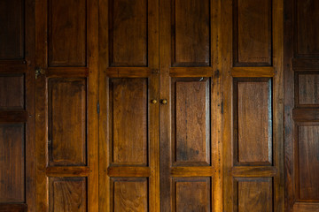 Dark brown Thai style wooden door