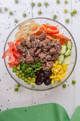 poke bowl with meat, fresh salad