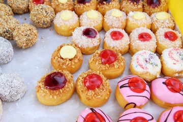 A lot of donut and strawberry jam