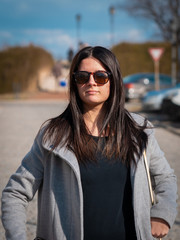 A young girl poses a photographer on a beautiful sunny day