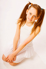 Fototapeta na wymiar little girl in white dress