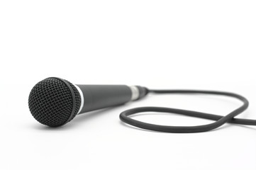 Black microphone on bright white background